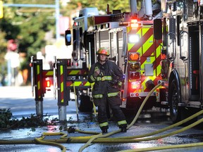 Vancouver Fire Rescue Services attend a three-alarm fire on Powell Street that left dozens homeless in the Downtown Eastside on Monday.