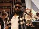 Louchiez Purifoy and his infamous Pennywise the Clown doll, from the Stephen King movie 