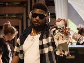 Louchiez Purifoy and his infamous Pennywise the Clown doll, from the Stephen King movie "It."