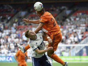 Houston Dynamo FC defender Sam Junqua (29) goes up for a header against Vancouver Whitecaps defender Julian Gressel (19) during the first half at B.C. Place. Photo: Anne-Marie Sorvin-USA Today Sports