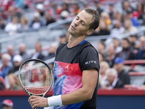 Canada's Vasek Pospisil reacts during his first round match against Tommy Paul of the United States at the National Bank Open tennis tournament Tuesday August 9, 2022 in Montreal.