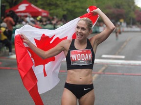 North Vancouver’s Natasha Wodak, shown celebrating victory in a 10k run at Ottawa Race Weekend in May 2019.