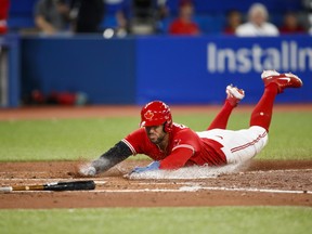 Toronto Blue Jays' George Springer scores on a single off the bat of Bo Bichette in the fourth inning against the Tampa Bay Rays.