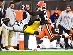 George Pickens #14 of the Pittsburgh Steelers makes a one handed catch ahead of Martin Emerson Jr. #23 of the Cleveland Browns during the second quarter at FirstEnergy Stadium on September 22, 2022 in Cleveland, Ohio.