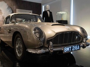An Aston Martin DB5 stunt car from the film "No Time to Die" is displayed during a photocall ahead of the "Sixty Years of James Bond" auction at Christie's auction house in London on Sept. 26, 2022.