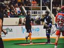 Curtis Dickson (No. 17) and Dane Dobbie celebrate a Langley Thunder goal in Saturday night's Mann Cup game in Peterborough.