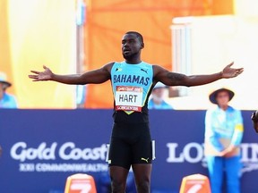 Shavez Hart of the Bahamas (C) reacts after a false start in the Men's 100 metres heatson day four of the Gold Coast 2018 Commonwealth Games at Carrara Stadium on April 8, 2018 on the Gold Coast, Australia. (Photo by Michael Dodge/Getty Images)