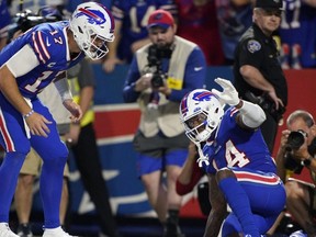 Bills quarterback Josh Allen (left) and wide receiver Stefon Diggs (right) celebrate a touchdown during the third quarter against the Titans at Highmark Stadium in Orchard Park, N.Y., Monday, Sept. 19, 2022.