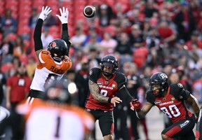 Ottawa Redblacks quarterback Jeremiah Masoli (8) throws the ball past the reach of B.C. Lions defensive back Loucheiz Purifoy (0) during first half CFL football action in Ottawa on Thursday, June 30, 2022.