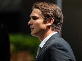 Former Vancouver Canucks player Jake Virtanen leaves B.C. Supreme Court during a lunch break after closing arguments in his sexual assault trial, in Vancouver, B.C., Monday, July 25, 2022.&ampnbsp;The Edmonton Oilers have signed Virtanen to a professional tryout agreement two months after the former Vancouver forward was found not guilty of sexual assault.