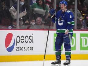 Vancouver Canucks' J.T. Miller watches as the Ottawa Senators celebrate the team's shootout win over Vancouver in April.