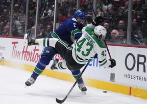 Hughes swaps sides, Schenn hits and Rathbone works 3 Vancouver Canucks’ Luke Schenn (2) checks Dallas Stars’ Marian Studenic (43) during the third period of an NHL hockey game in Vancouver on April 18, 2022.