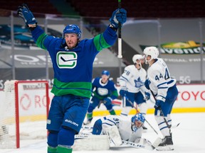 Vancouver Canucks host the Toronto Maple Leafs at Rogers Arena in Vancouver March 6, 2021. Canucks' JT Miller celebrates after scoring a goal against the Leafs during the third period of play.