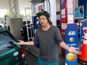 Gip Mar fills-up his car in Vancouver, BC Wednesday, September 28, 2022. Rising prices for fuel and groceries is making it harder for people to make ends meet.