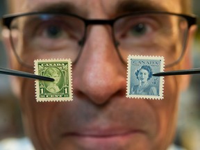 Brian Grant Duff of All Nations Stamps&Coins with Queen Elizabeth stamps	 in Vancouver, BC, September 15, 2022.