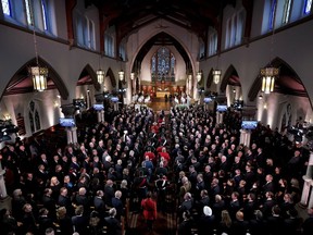 A procession arrives into the chapel during commemorative ceremonies for Queen Elizabeth at Christ Church Cathedral, in Ottawa, Monday, Sept.19, 2022.