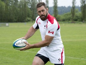 Rugby Canada team member Jamie Cudmore wears his new uniform at the team's training center in Burnaby, British Columbia, Tuesday June 3, 2014. The former Canada rugby captain believes that he has a lot more to give to the game.  Now he hopes others will agree.  THE CANADIAN PRESS/Jonathan Hayward
