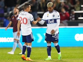 Sep 10, 2022; Commerce City, Colorado, USA; Vancouver Whitecaps FC midfielder Andres Cubas (20) and FC midfielder Pedro Vite (45) following a score in the first half at Dick's Sporting Goods Park.