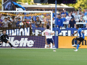 San Jose Earthquakes forward Jeremy Ebobisse (11), right, scores a goal against Vancouver Whitecaps goaltender Thomas Hasal (1, left) during the first half at PayPal Park.