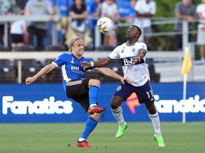 San Jose Earthquakes forward Tommy Thompson, left, and Vancouver Whitecaps forward Cristian Dajome battle for the ball at PayPal Park on Sept. 4, 2022.