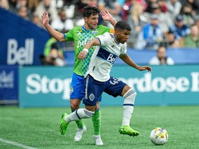 Vancouver Whitecaps midfielder Pedro Vite gets past Seattle Sounders midfielder Nicolas Lodeiro in the second half at BC Place during their game last September. Vite scored in that game, the first victory over the Sounders since 2017.