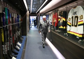 Vancouver Canucks head coach Bruce Boudreau walks past the locker room before their NHL game against the Winnipeg Jets at Rogers Arena on December 10, 2021.