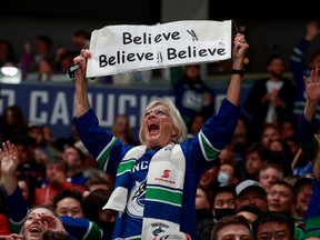 A Vancouver Canucks fan holds up a sign during the NHL game against the Dallas Stars at Rogers Arena on April 18, 2022. Photo: Jeff Vinnick/NHLI via Getty Images