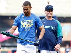 Mariners manager Scott Servais, on the right with young superstar Julio Rodriguez, has been in the job since October 2015 and, after a rough start this season, has been in manager of the year conversations.