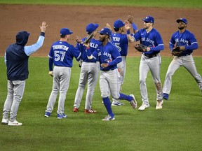 The Toronto Blue Jays celebrate after a 5-1 victory against the Baltimore Orioles during game two of a doubleheader at Oriole Park at Camden Yards on October 05, 2022 in Baltimore, Maryland.