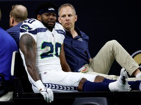 Rashaad Penny #20 of the Seattle Seahawks is carted off the field after being injured during the third quarter against the New Orleans Saints at Caesars Superdome on October 09, 2022 in New Orleans, Louisiana.