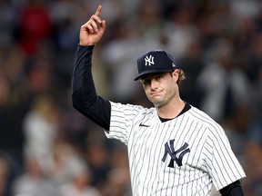 NEW YORK, NEW YORK - OCTOBER 11: Gerrit Cole #45 of the New York Yankees celebrates closing out the top of the sixth inning against the Cleveland Guardians in game one of the American League Division Series at Yankee Stadium on October 11, 2022 in New York, New York.