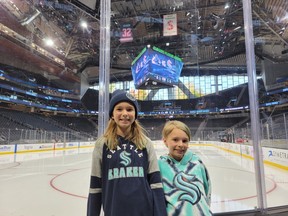 Scarlett (left) and Renee Carmichael at a recent NHL Kraken game at Climate Pledge Arena.