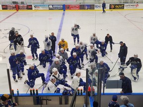 Abbotsford Canucks head coach Jeremy Colliton gathers the group together for some instructions at training camp in Port Coquitlam on Friday, October 7, 2022.