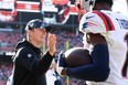 Mac Jones of the New England Patriots celebrates with Tyquan Thornton.