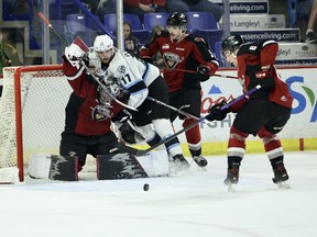 Vancouver Giants goaltender Jesper Vikman fends off Owen Pederson  of the Winnipeg Ice during Winnipeg's 4-3 win at the LEC on Wednesday. Vikman sparkled in the Giants goal, making 44 saves.