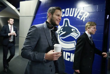 Kevin Bieksa #2 of the Anaheim Ducks carries a coffee as he walks to the team dressing room before their NHL game against the Vancouver Canucks at Rogers Arena December 1, 2016.