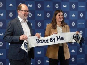 Stephanie Labbé (right) is introduced as the Vancouver Whitecaps' new general manager of women's soccer by club president and CEO Axel Schuster on Thursday.