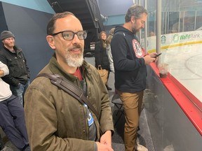 Seattle hockey parent David Sheldon watches the Washington Wild practice at Kraken Community Iceplex in Seattle.