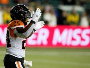 Never Miss is visible on a billboard in the background as B.C. Lions' James Butler (24) celebrates a touchdown against the Edmonton Elks during first half CFL action at Commonwealth Stadium in Edmonton, Friday, Oct. 21, 2022.