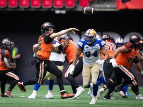 Nathan Rourke, feeling the heat from Winnipeg Blue Bombers defenders during a B.C. Place Stadium game earlier this season, will be trying to shake off injury-induced rust against these same Bombers on Friday in the Lions' regular season finale.