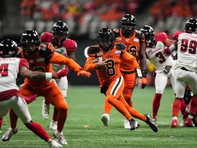 B.C. Lions quarterback Vernon Adams Jr. (8) runs the ball for a first down during the second half of a CFL football game against the Ottawa Redblacks in Vancouver, on Friday, September 30, 2022.