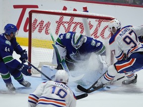 Canucks goalie Spencer Martin denies Oilers superstar Connor McDavid on Wednesday in Abbotsford.