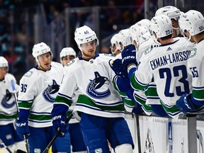 Vancouver Canucks center Elias Pettersson (40) celebrates with the bench after scoring a goal against the Seattle Kraken during the third period at Climate Pledge Arena. Vancouver defeated Seattle 5-4. Photo: Steven Bisig-USA TODAY Sports