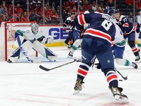 Washington Capitals left wing Alex Ovechkin (8) scores a goal on Vancouver Canucks goaltender Thatcher Demko (35) in the first period at Capital One Arena.