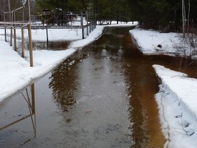 Floodwaters cover Ray Chipeniuk's driveway near Smithers, B.C. in this 2018 handout photo. The British Columbia government has settled for $300,000 on the day a trial was set to begin over a lawsuit filed by a couple whose property flooded twice in the years after a third of the forests in the surrounding watershed were cut down. THE CANADIAN PRESS/HO, Ray Chipeniuk