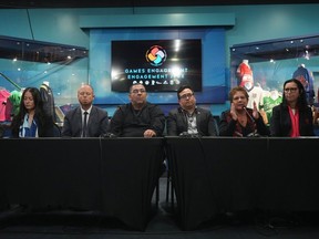 (From left) Canadian Paralympic Committee vice-president Gail Hamamoto, Whistler Mayor Jack Crompton, Musqueam Chief Wayne Sparrow, Squamish Nation councillor Wilson Williams, Tsleil-Waututh Nation Chief Jen Thomas, and Canadian Olympic Committee president Tricia Smith attend a news conference about their 2030 Olympic bid in Vancouver on Friday.
