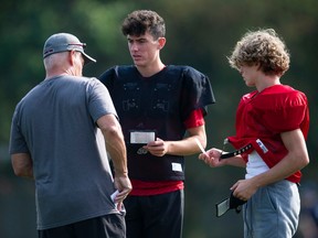 Ravens quarterback Owen Sieben, centre, at team practice at Terry Fox Secondary in Port Coquitlam on Sept. 13.