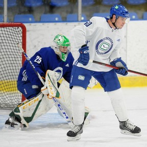 Aidan McDonough in action in front of Brett Brochu during the Vancouver Canucks development camp at the University of British Columbia in Vancouver, BC., on July 13, 2022.