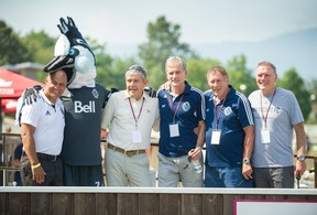 Former Vancouver Whitecaps (left to right) Carl Valentine, mascot Spike, Gerry Heaney, and the Lenarduzzi brothers; Dan, Sam and Bob at the 2nd annual Sports Alumni Day at Hastings Racecourse in Vancouver on July 29, 2018.