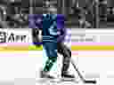 Jett Woo skates during NHL pre-season action against the Calgary Flames on Sept. 25, 2022.